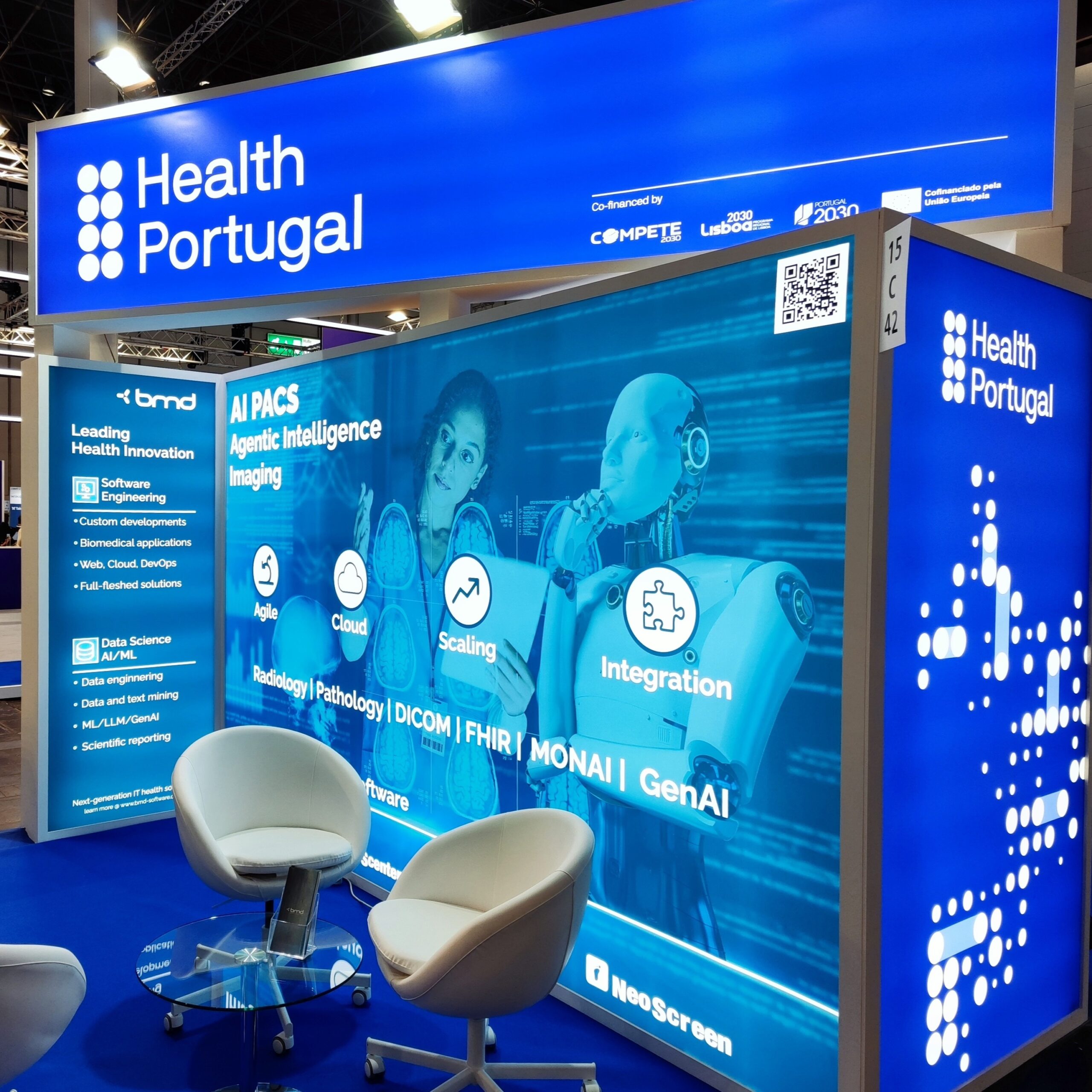 Health Portugal pavilion booth at MEDICA displaying BMD's AI PACS and agentic intelligence imaging solutions with modern seating area.