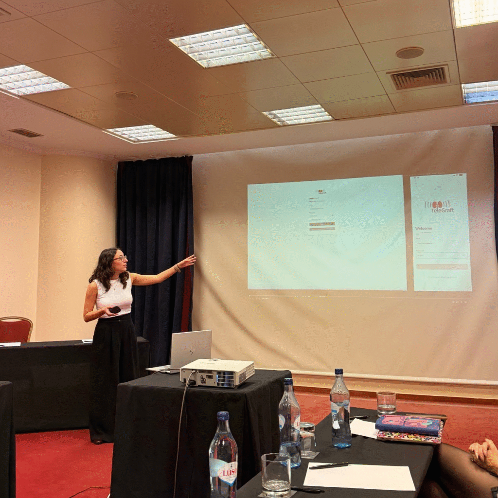 BMD's Software engineer Mariana Rosa demonstrating the web dashboard and mobile application for remote patient monitoring.