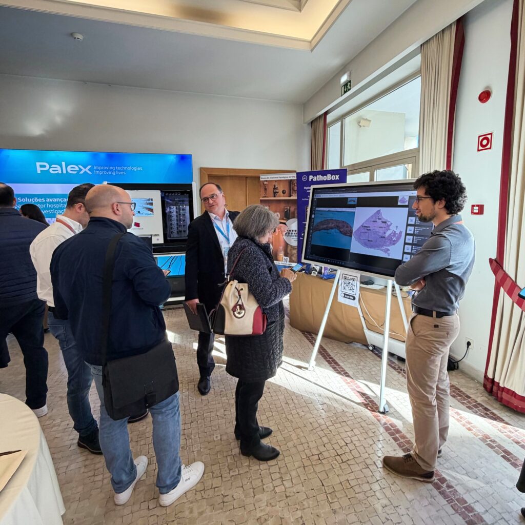 Rui Jesus demonstrating PathoBox digital pathology solution on a touchscreen during SPAP national conference.