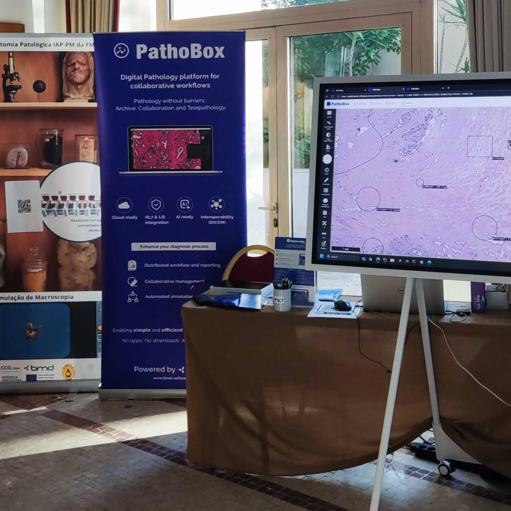 PathoBox digital pathology solution, interface on screen with rollup displaying its main features.